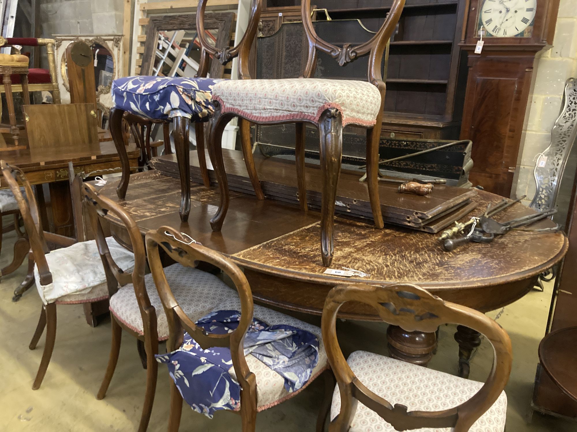 A set of six Victorian balloon back rosewood dining chairs